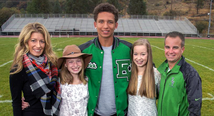 Photo: Family posing on the football field