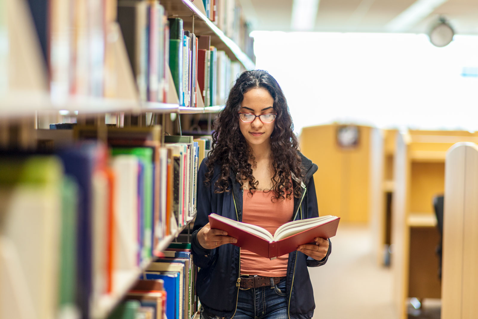 Picture: Student reading a book in the library